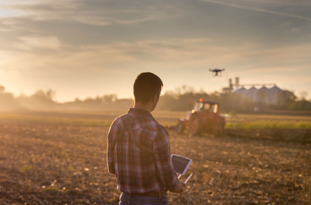 Farmer using drone to monitor crops.  iStock.com/Jevtic