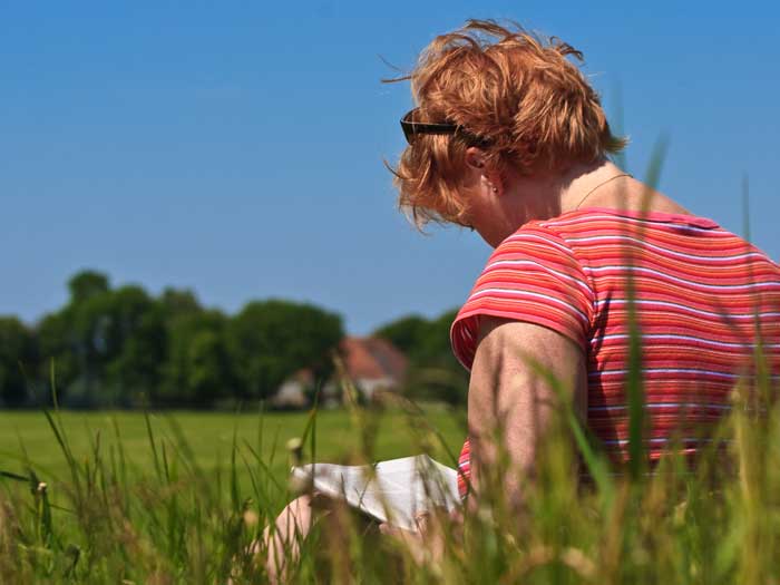 Young person researching potential careers while in a field. Picture: Shutterstock/Peter Wollinga