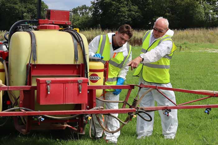 Young person training how to fill the sprayer. Picture: Riccardo Magliola at Harper Adams.