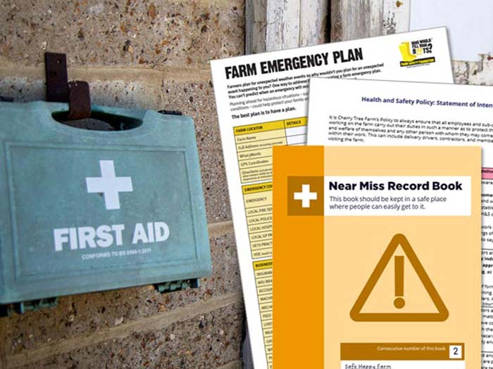 A first aid box next to farm safety information